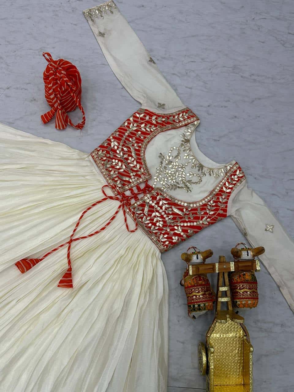 Pure Chinon and Laheriya Print gotta pati gown with attached jacket with matching hand purse