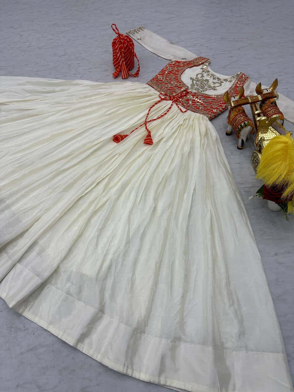 Pure Chinon and Laheriya Print gotta pati gown with attached jacket with matching hand purse